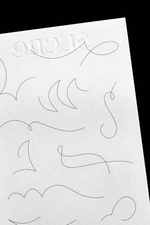 Abstract graphic design on white paper with embossed text, featuring minimalist line art, clean aesthetic, and embossed design.