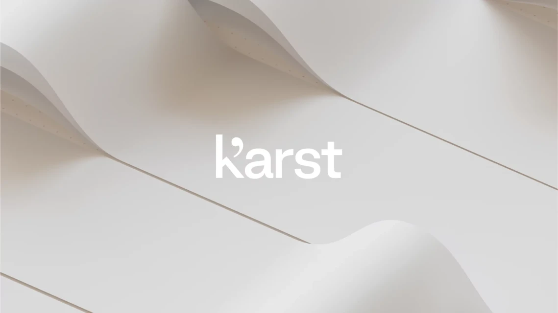 Abstract shot of curving white panels with the Karst logo, creating a minimalist, elegant visual.