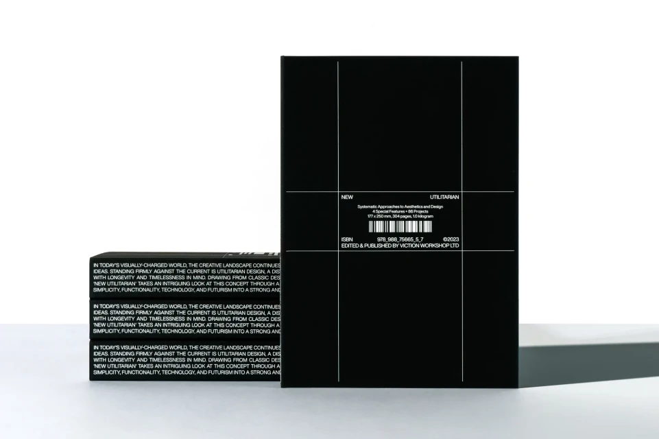 Stack of black books and a black book box with white lettering and minimalistic graphic design against a white background.