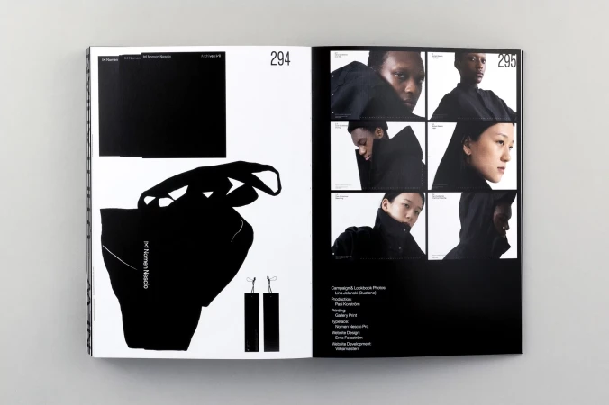 Magazine spread features black-and-white fashion photography with minimalist design elements, showcasing modern aesthetics and style.