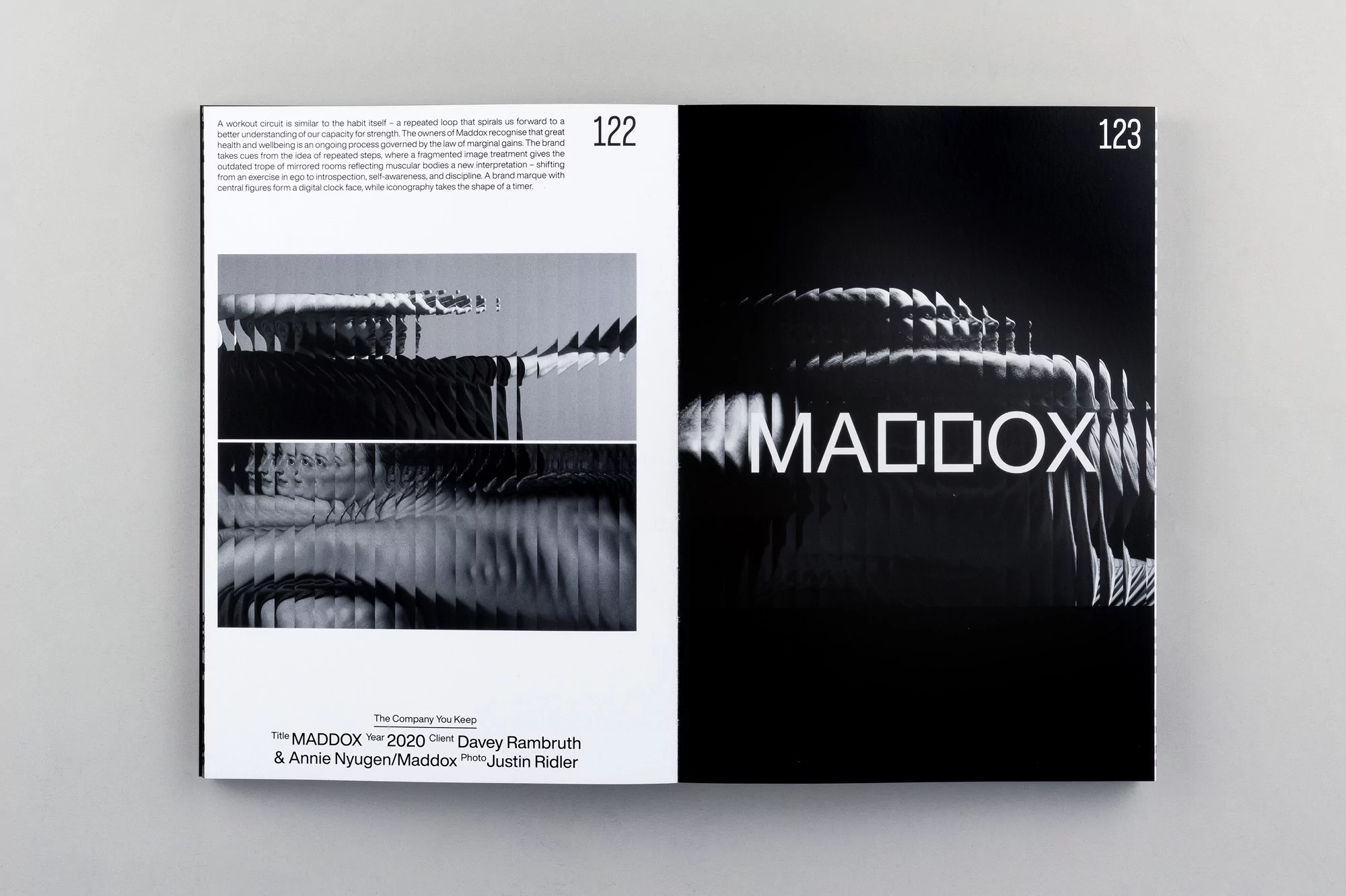 Open magazine spread featuring abstract design with optical illusions in black and white tones and 'MADDOX' printed in bold letters.