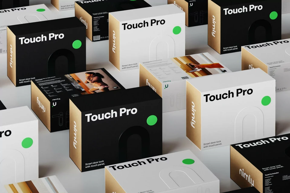 Product shot of black and white boxes for 'Touch Pro' smart door lock, arranged on a white surface, featuring minimalist design and branding.