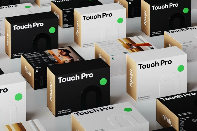 Product shot of black and white boxes for 'Touch Pro' smart door lock, arranged on a white surface, featuring minimalist design and branding.