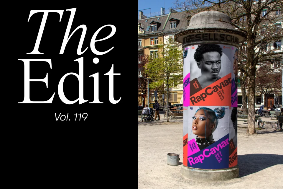 Outdoor scene featuring a column adorned with RapCaviar posters of Roddy Ricch and Megan Thee Stallion in a European city park.