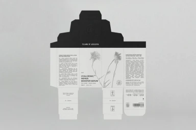 Unfolded black and white skincare product packaging box flat lay with botanical illustration on grey background