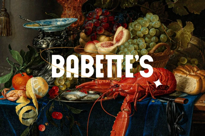 Dutch Golden Age still life painting featuring a lobster, fruits like grapes and peaches, oysters, bread, and an orange and lemon.
