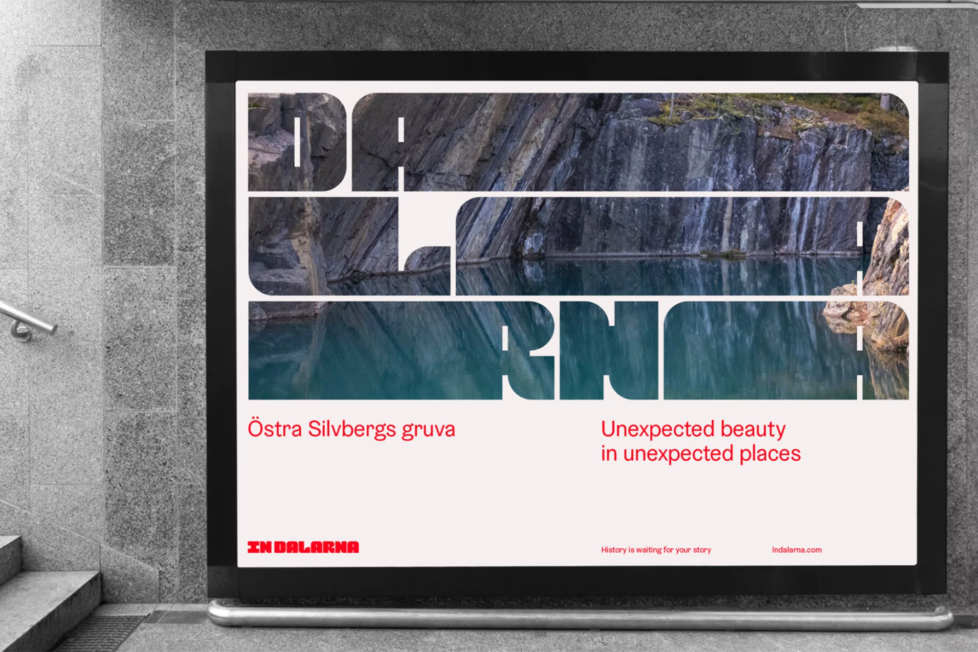 Promotional poster featuring a quarry with teal water, the image bisected by overlaid white text, 'DALARNA', mounted on a gray wall.