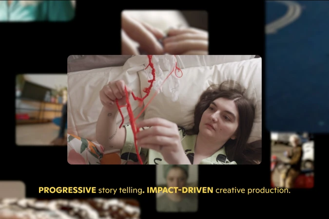 An adult woman lying in bed, indoors, holding red yarn, with other images blurred in the background against a black backdrop.