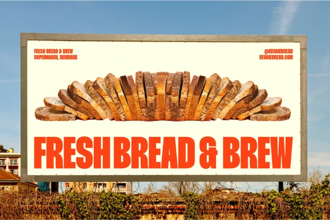 Billboard featuring slices of bread arranged in a semicircle with the text FRESH BREAD & BREW in red, set against a blue sky backdrop.