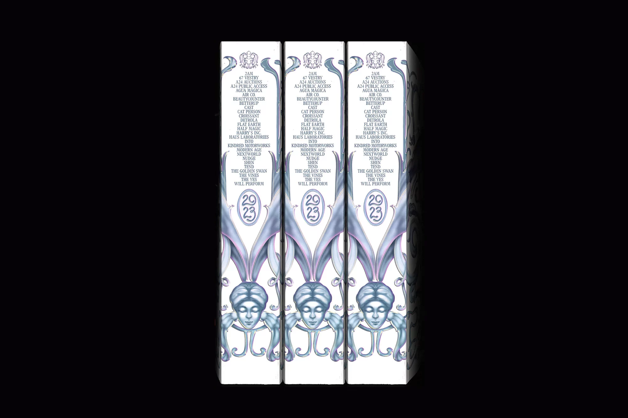 Three white book spines, side-by-side, feature blue art nouveau-style illustrations and lettering on a solid black backdrop.
