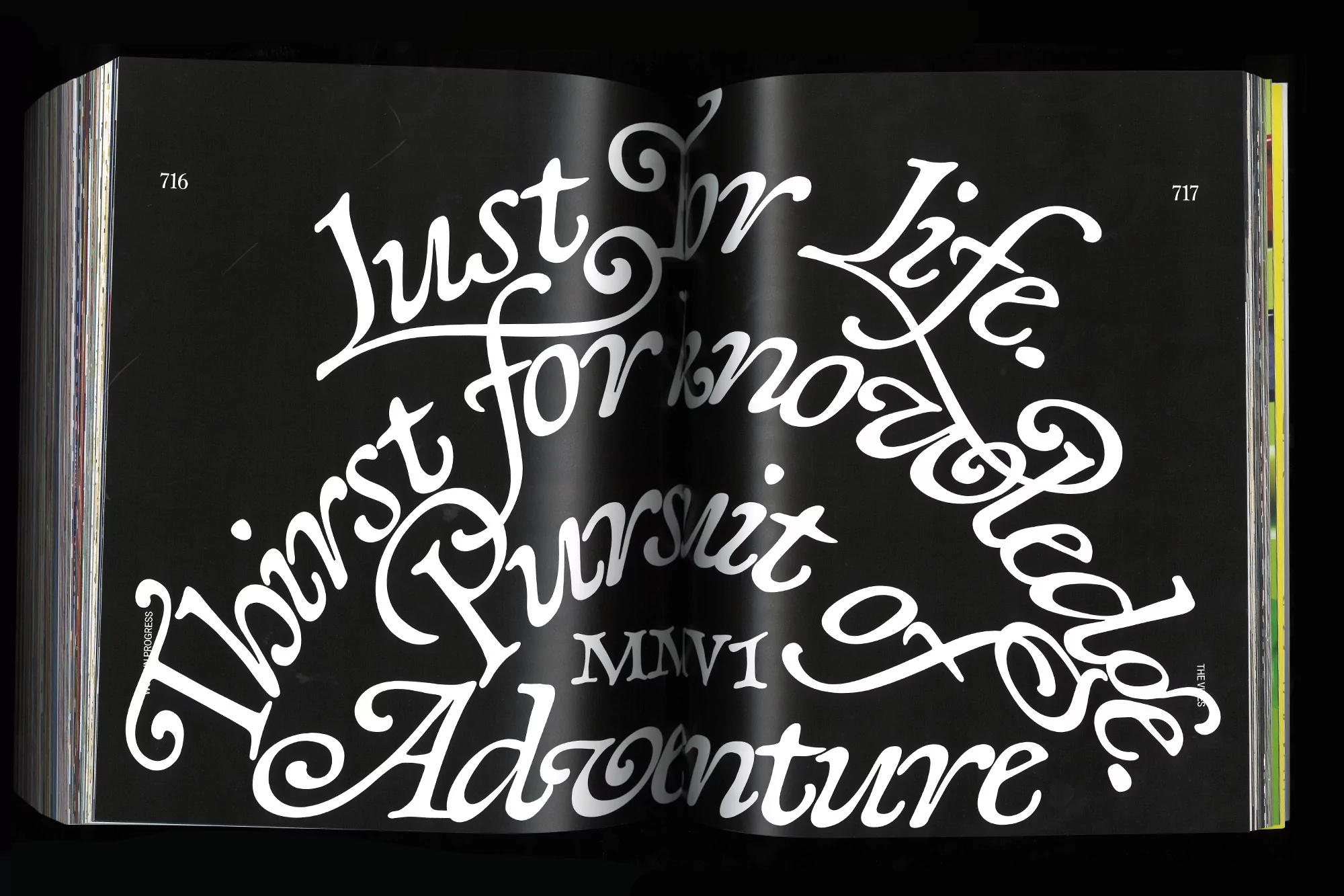 Open book pages displaying typography with swirling letters, featuring text reading 'Thirst for Knowledge' and 'Adventure' on a black background.