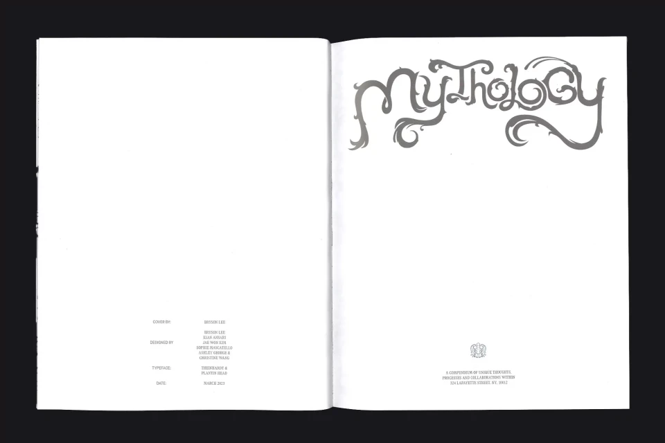 Open book spread featuring stylized typography of the word 'Mythology' on the right page and publication details on the left page.