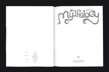 Open book spread showing custom typography spelling Mythology on the right page and publication credits on the left
