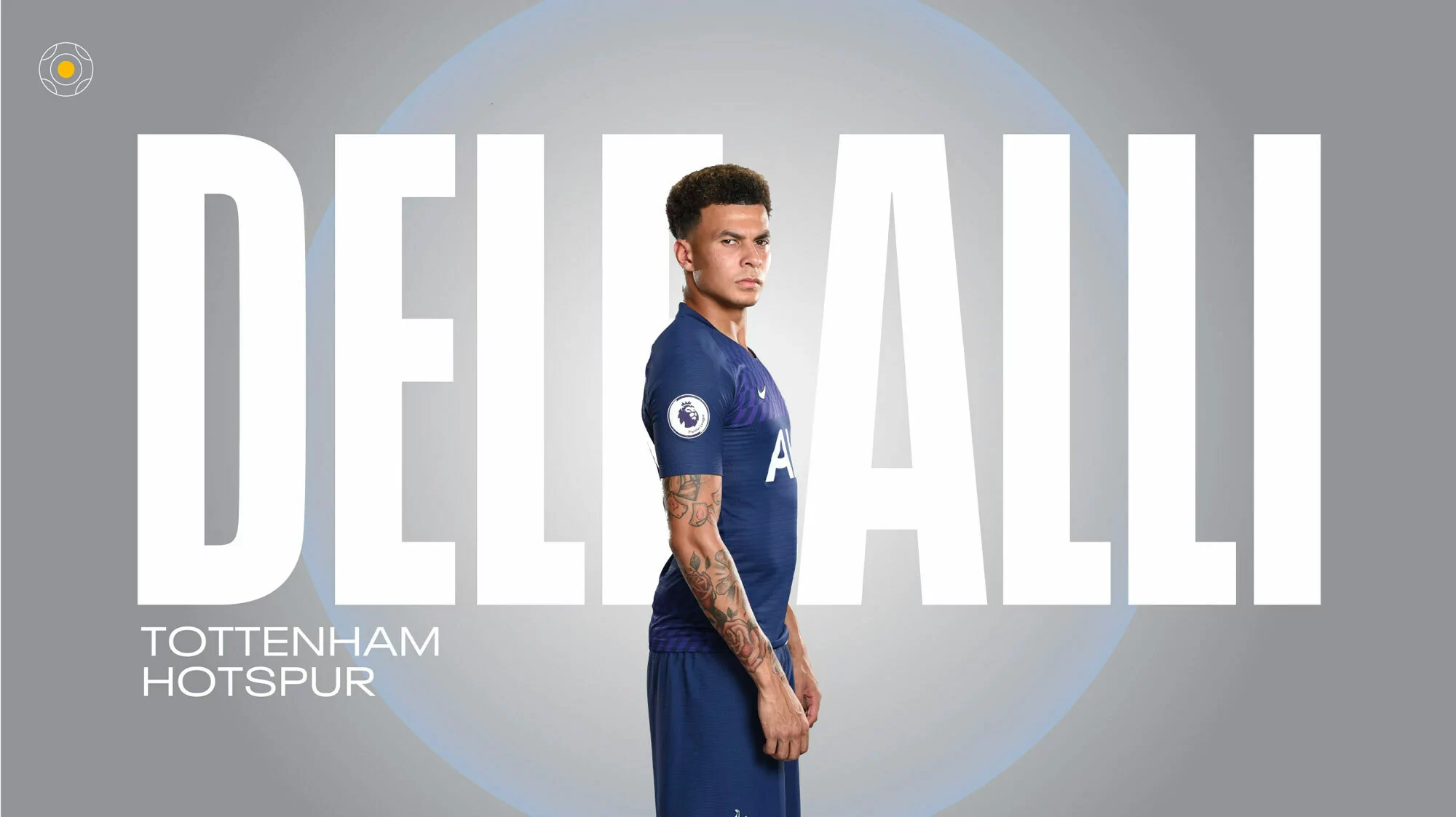 A profile shot of Dele Alli in a blue Tottenham Hotspur jersey stands against a grey background with his name and team name in white.