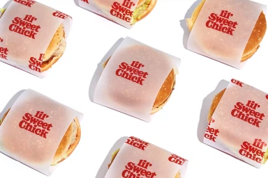 Top-down view of six wrapped burgers arranged on a plain white surface for Souper Duper brand identity.