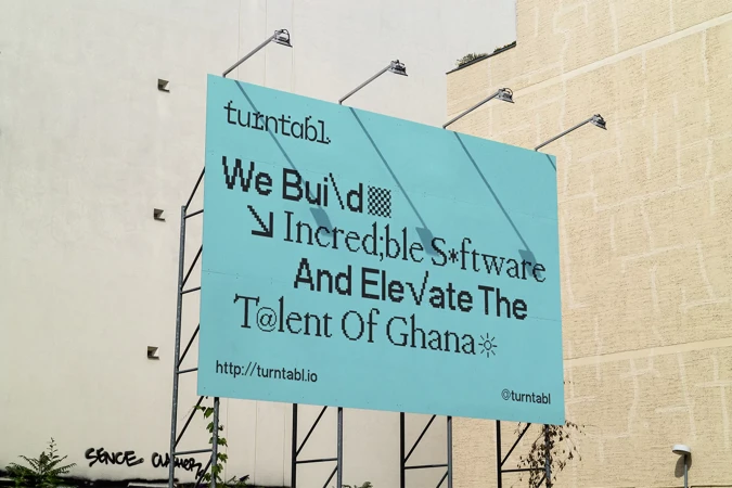 Outdoor billboard advertising Turntabl software company, featuring pixelated typography and the phrase 'We Build Incredible Software'.