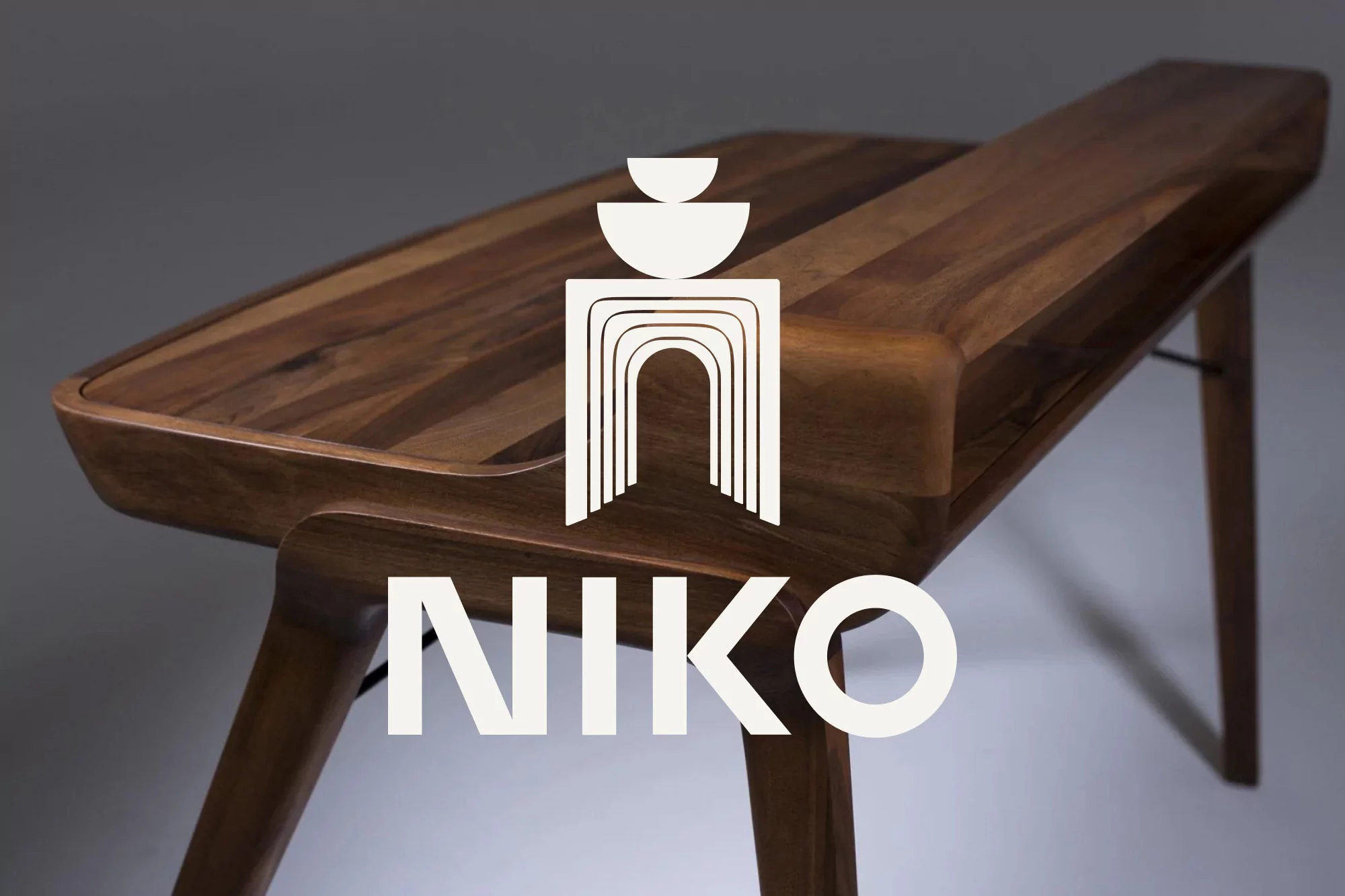 Studio shot of a handcrafted, sleek wooden console table with minimalist design and visible wood grain, under soft, diffused lighting.