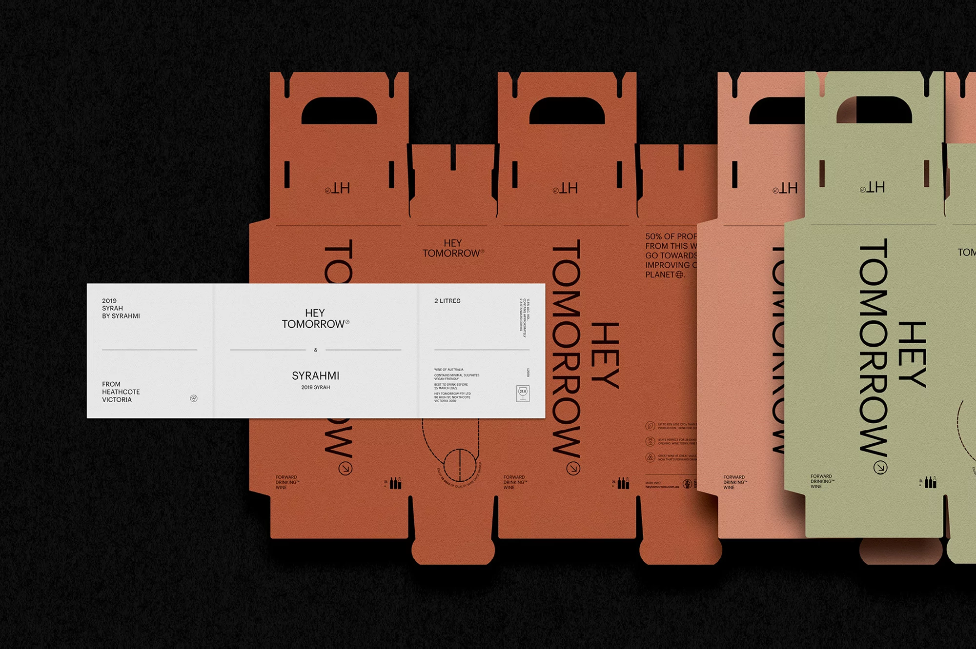 Cardboard packaging mockups with 'Hey Tomorrow' branding and wine bottle graphic, eco-friendly design with earth-tone color palette.