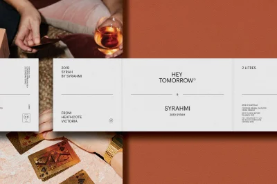 Minimalist wine packaging label design for Hey Tomorrow brand with clean typography against a rust-coloured background.