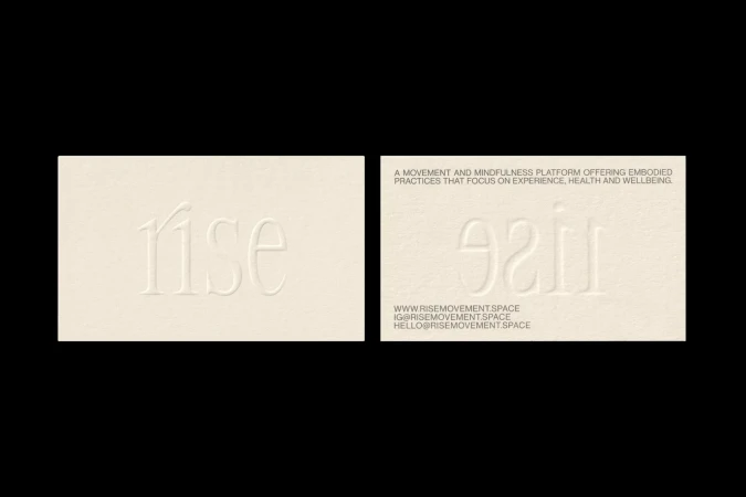 Minimalist business cards featuring embossed 'rise' text, clean design, and neutral cream tones, creating a sophisticated, professional aesthetic.