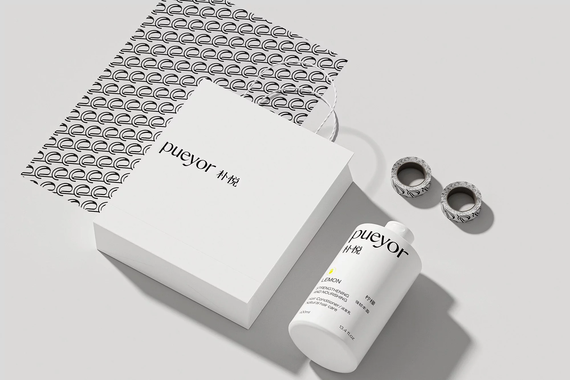 Pueyor lemon-scented strengthening and nourishing hair care set. White bottle and gift box displayed on a clean, well-lit surface.