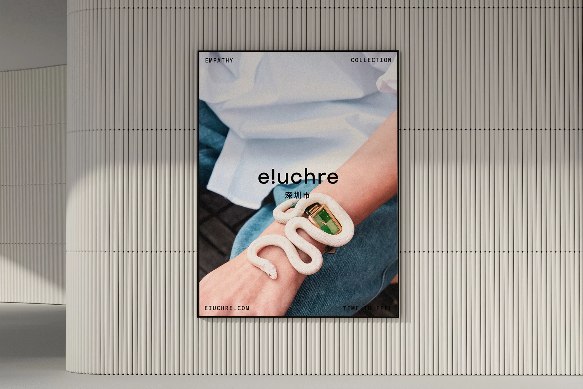 Close-up of a fashion poster showcasing a model's arm with a decorative snake bracelet in an indoor setting with a ribbed wall background.