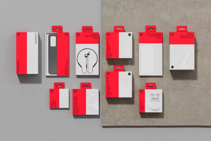 OnePlus mobile phone accessories, including phone case, earbuds, chargers, and screen protector, arranged in original packaging against grey background.