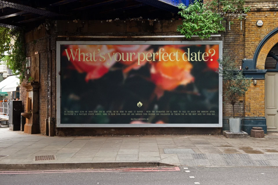 Outdoor advertising billboard for Ballroom is displayed on brick wall with floral pattern, dark background and text overlay in neutral setting.
