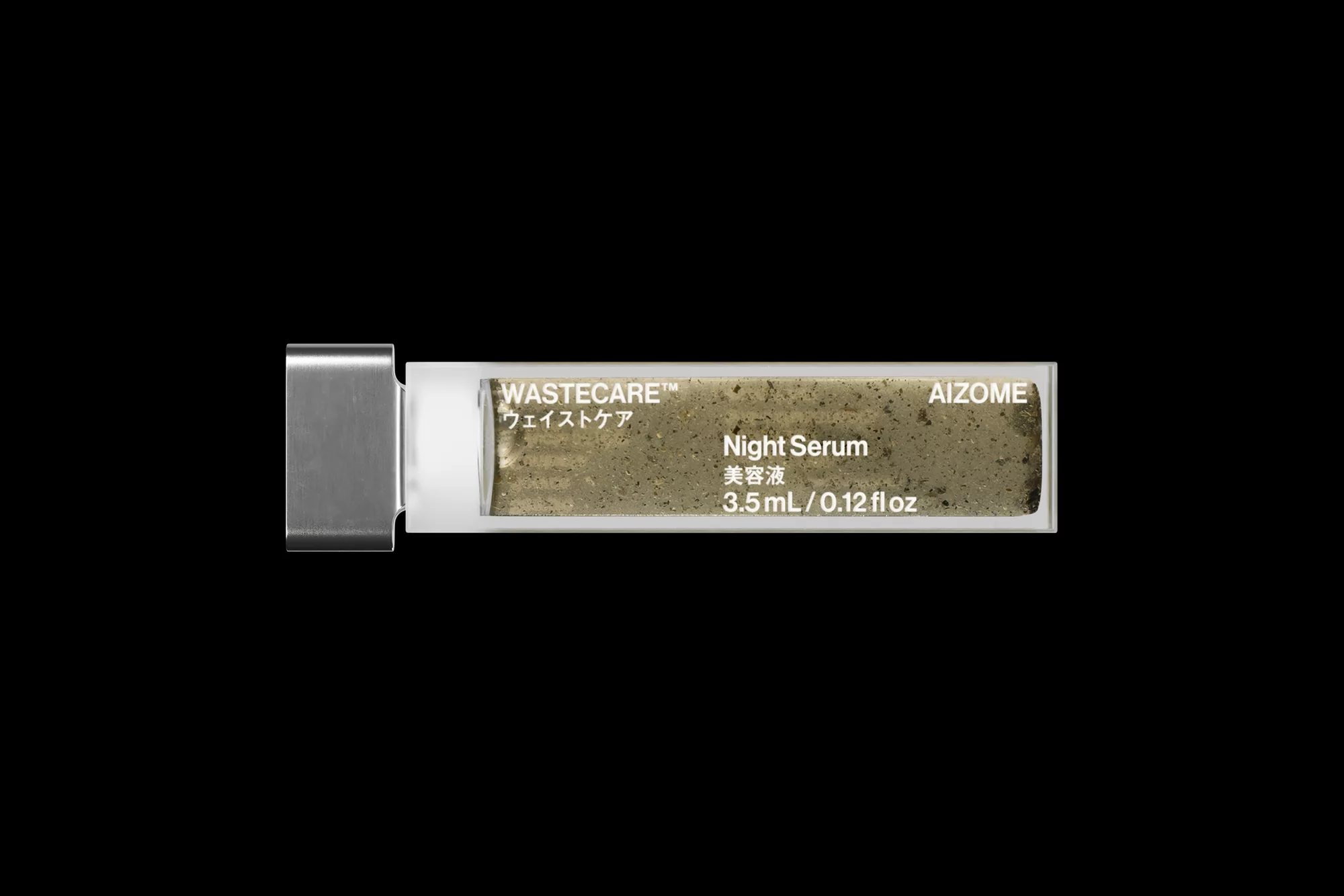 Product shot of AIZOME WASTECARE Night Serum in its container. The clear case displays the product and branding against a black background.