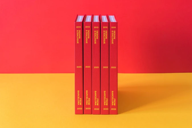 Five red books stand side by side, their spines visible, featuring yellow text on a red and yellow background.