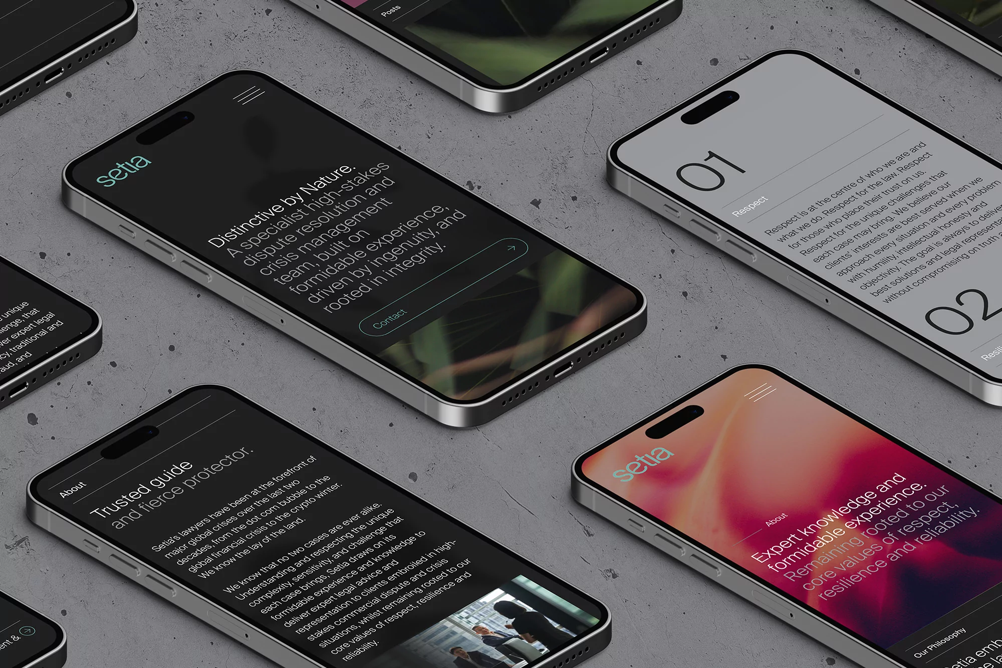Multiple smartphones display website designs with focus on text and UX, set against a grey stone backdrop, showcasing digital interface.