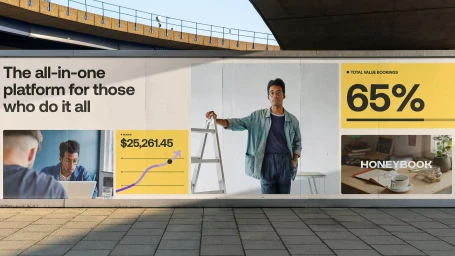 Outdoor billboard display featuring Honeybook brand identity with photography, data metrics, and typography.