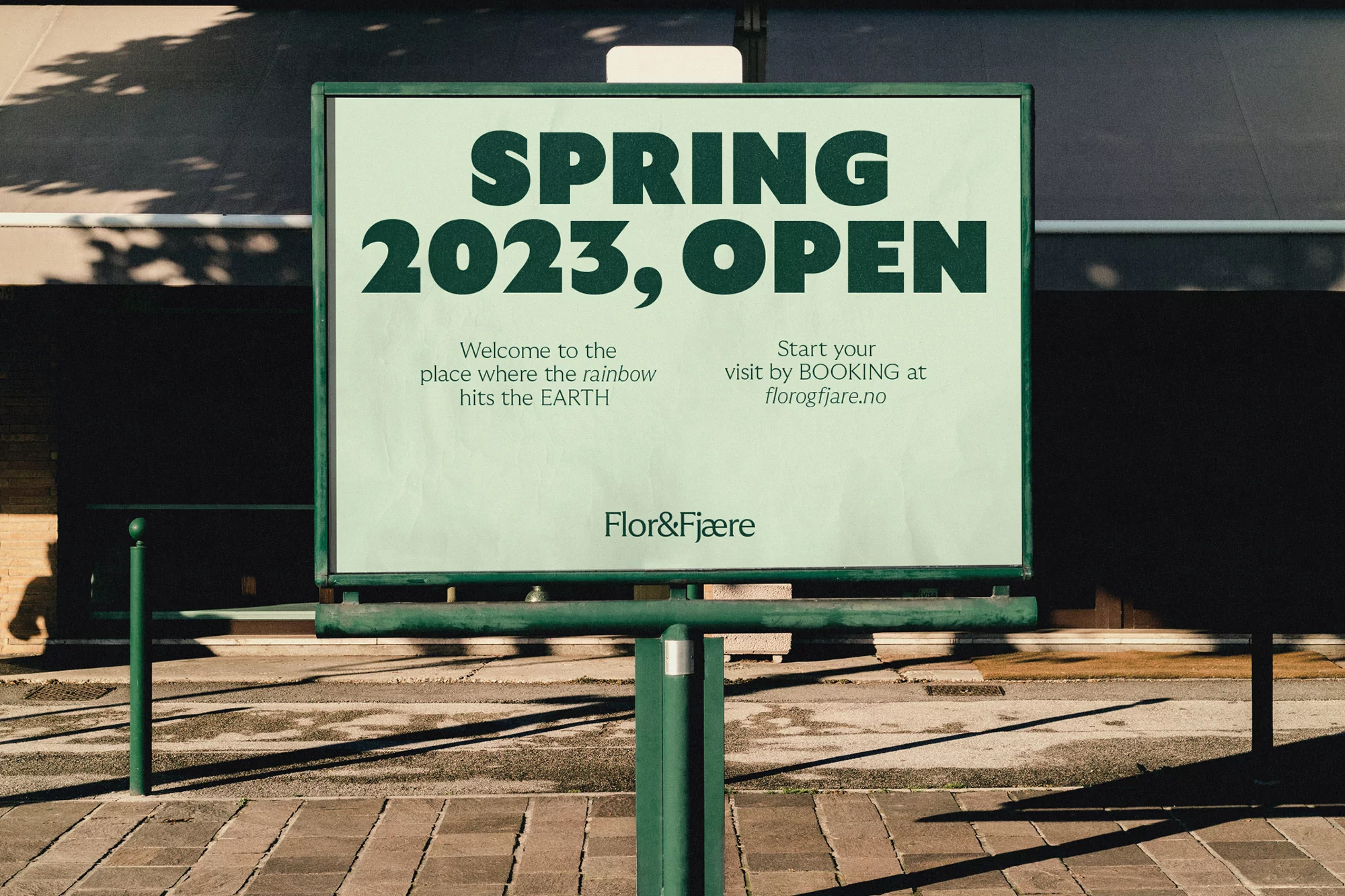 A billboard advertisement for Flor & Fjaere announces 'Spring 2023, Open' in bold dark-green font, promoting visits to florogfjare.no.
