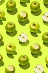 Top-down view of whole and sliced green apples in a repeating grid pattern against a vibrant lime green background.