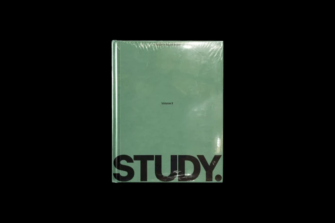 Sealed sage-green book with 'STUDY' in bold black letters on a black backdrop, creating a simple yet impactful design.