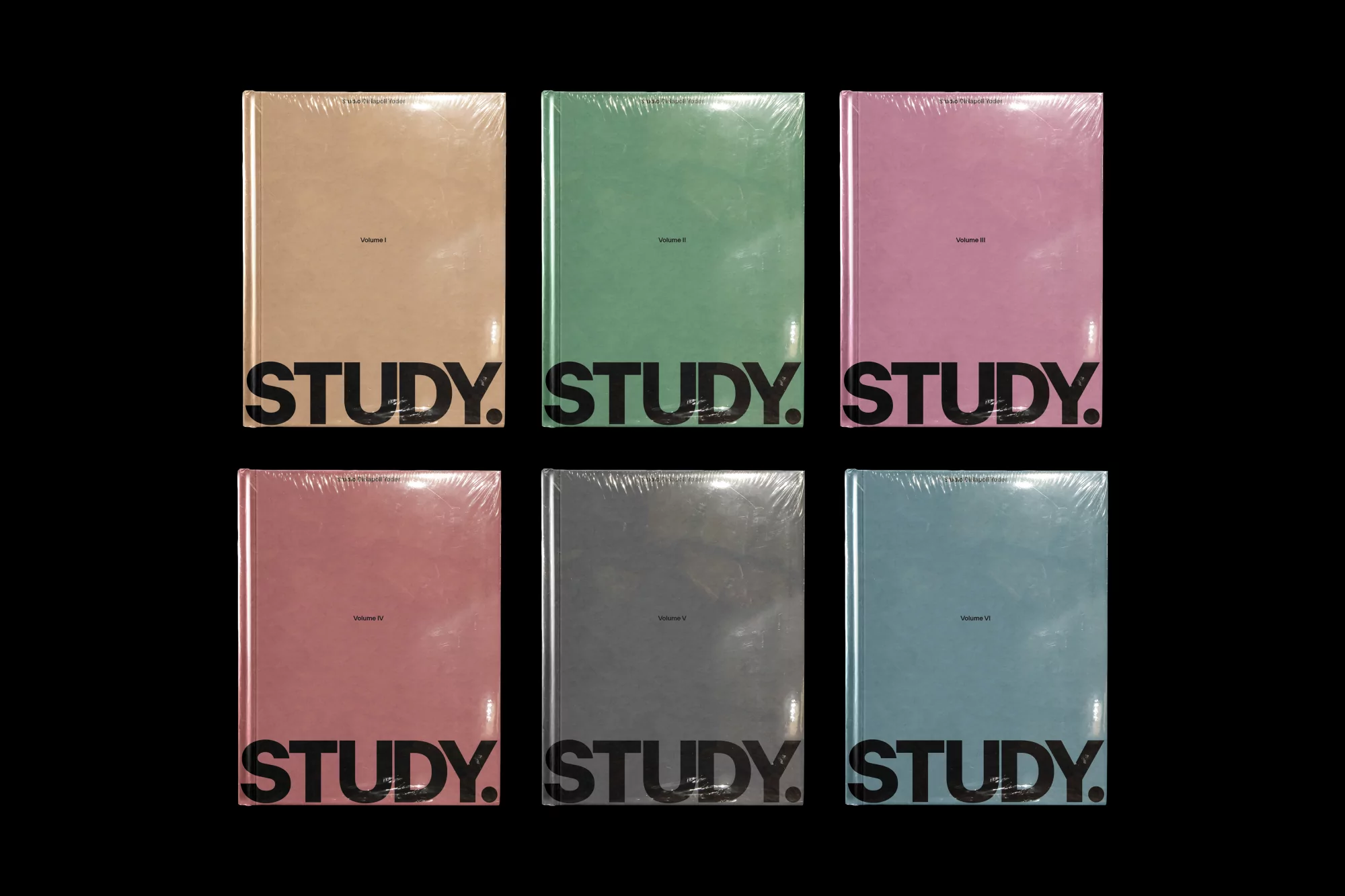 Six colorful hardcover books wrapped in plastic with the word 'STUDY' printed on the cover, arranged against a black background.