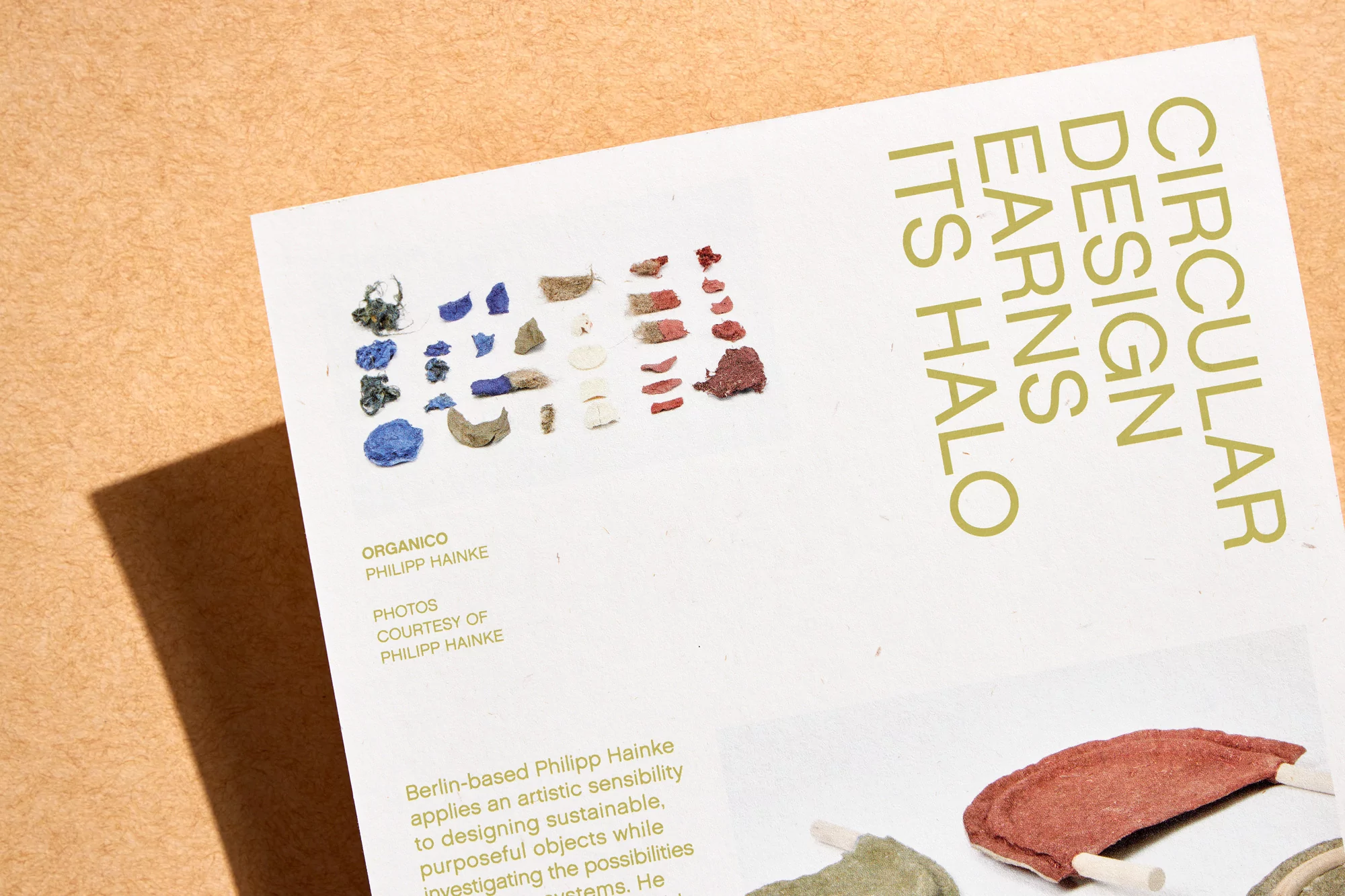 Promotional image featuring samples of biodegradable material alongside text: 'Circular Design Earns Its Halo' and design company information.