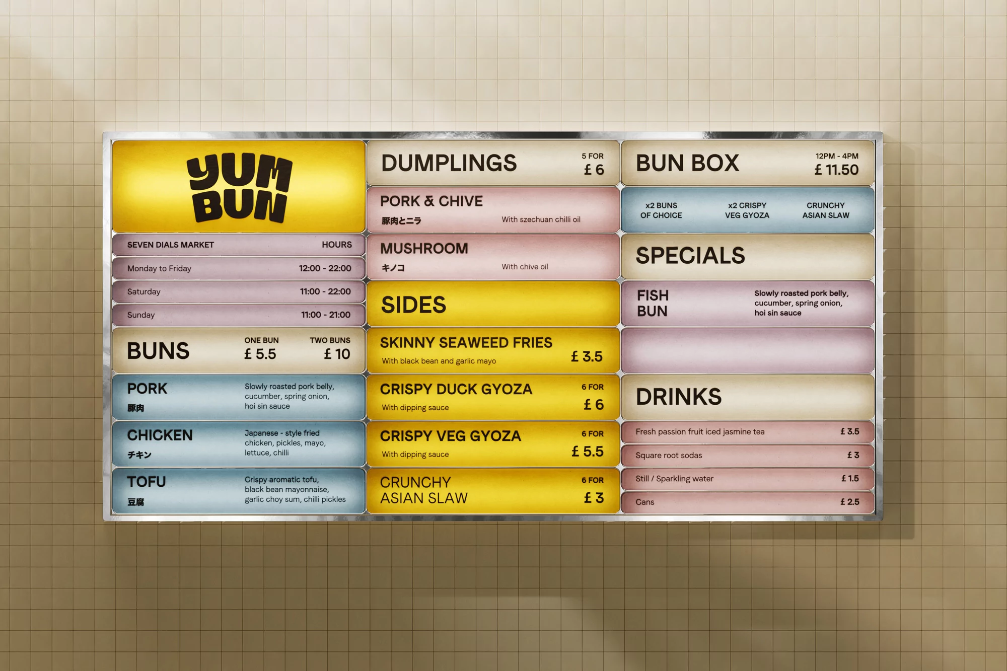 Menu board displaying a variety of Asian food options, including buns, dumplings, sides, and drinks with prices and descriptions.