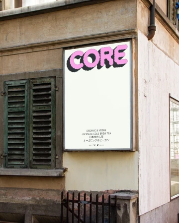 Outdoor advertisement on a building corner featuring pink and black 'CORE' text and smaller text about organic Japanese cold brew tea.