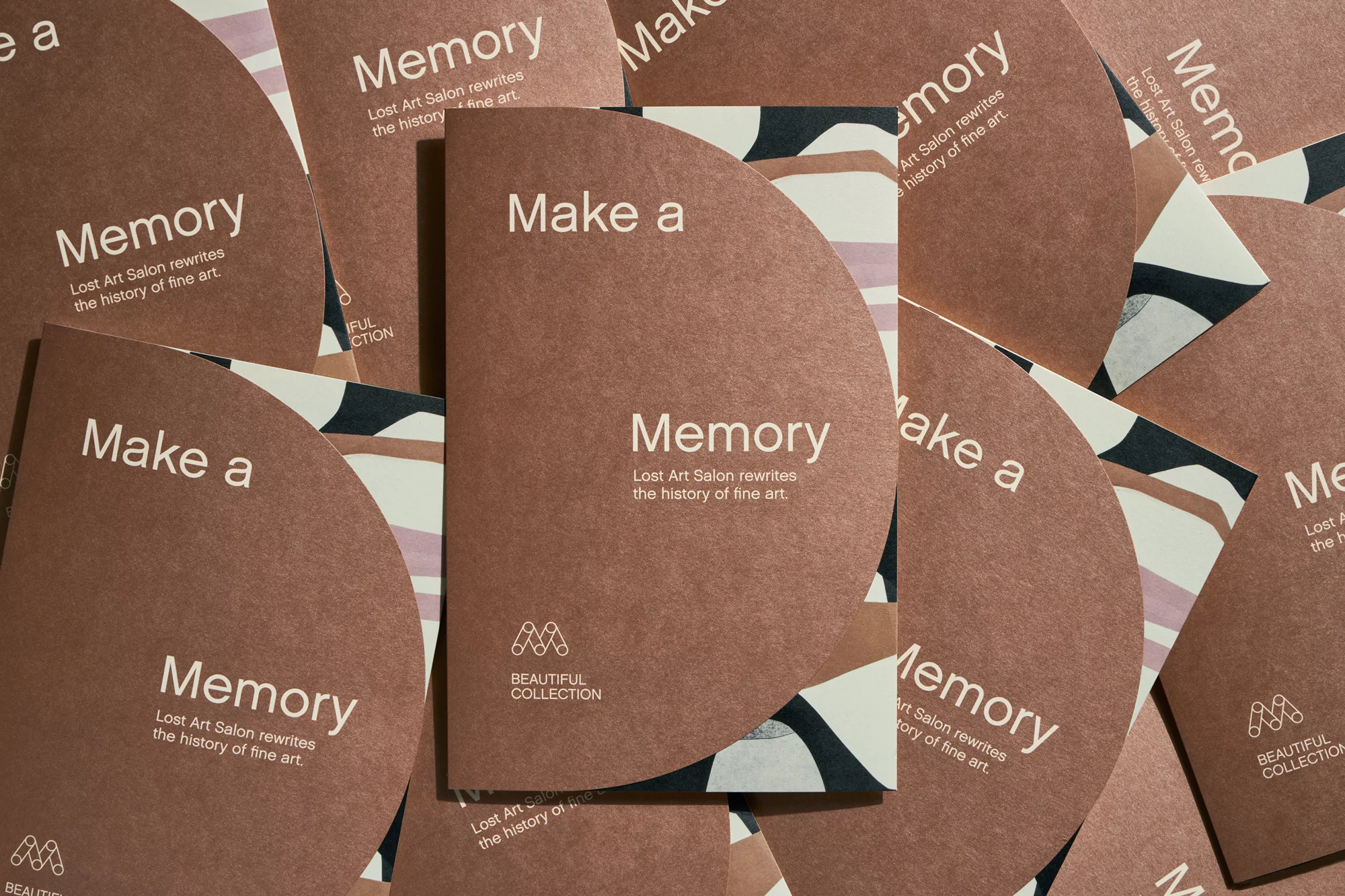 Art brochures featuring geometric design and text 'Memory' are scattered, creating a visually appealing pattern for marketing.
