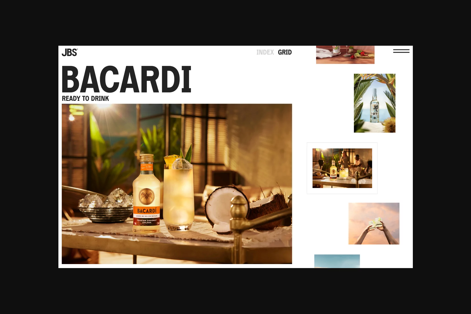 Bacardi bottle and cocktail glass featuring a tropical drink with ice and pineapple garnish, placed on a bar with coconuts.