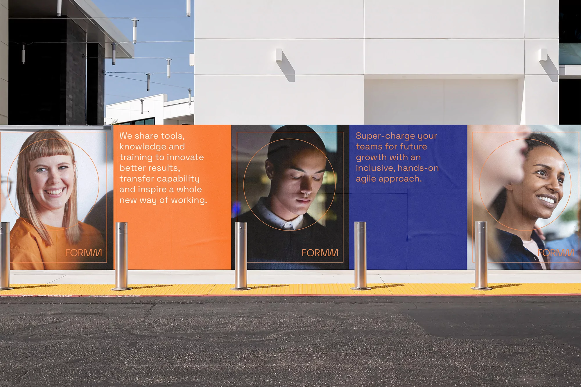 Building with posters of three smiling people of diverse backgrounds, promoting tools and training for future growth and innovation.