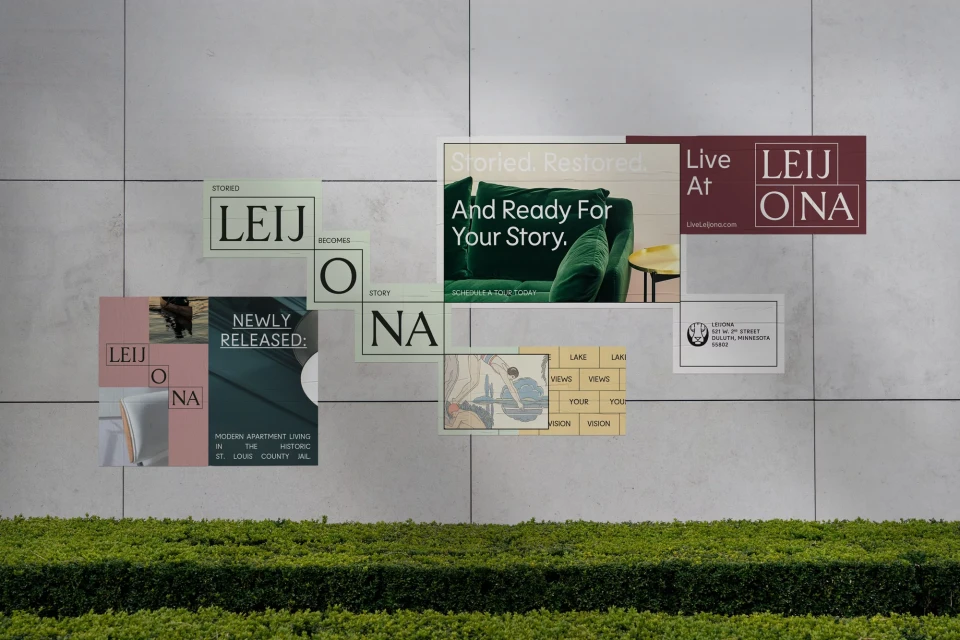 Outdoor wall features advertisements for LEIJONA apartments, showcasing modern apartment living in historic St. Louis County, Minnesota.