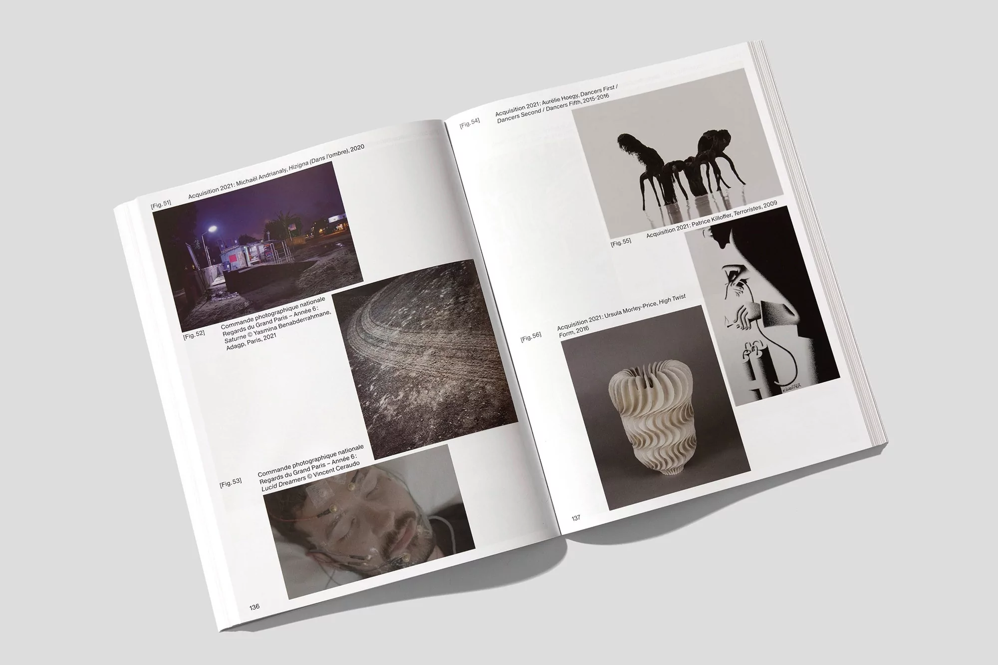 Open book pages with assorted photos: outdoor street scene, abstract circular pattern, portrait, product shot, figure drawing.