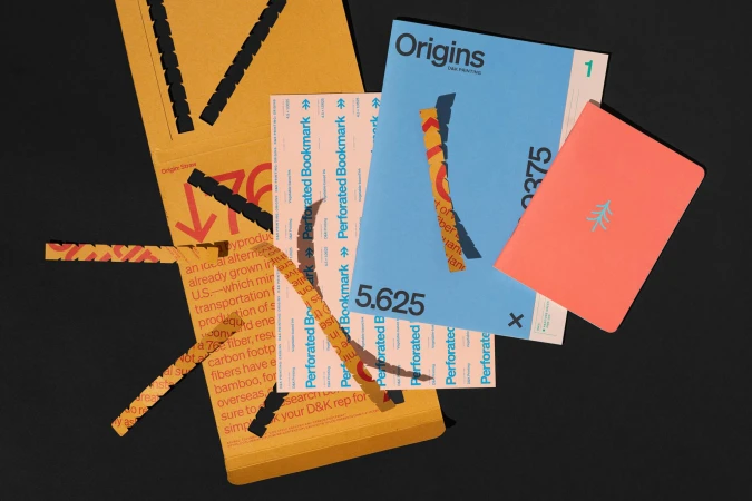 Graphic design layout featuring a mix of perforated bookmarks, paper ephemera, and stationery on a solid black background.