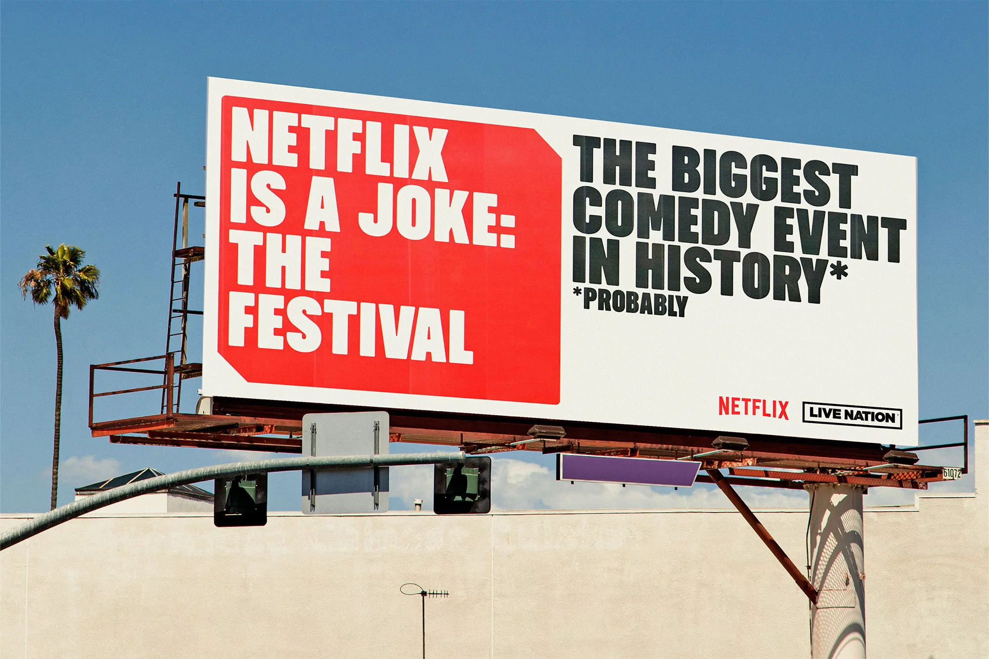 Outdoor billboard advertisement for the Netflix Is A Joke comedy festival, set against a clear blue sky in an urban environment.