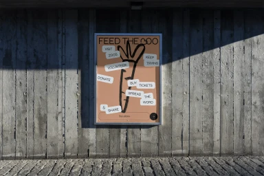 A framed graphic poster featuring a hand-drawn carrot illustration and text bubbles mounted on a vertical concrete wall.