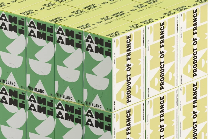 Stacks of green and light yellow wine boxes featuring a geometric pattern and bold typography, suitable for beverage or product packaging concepts.