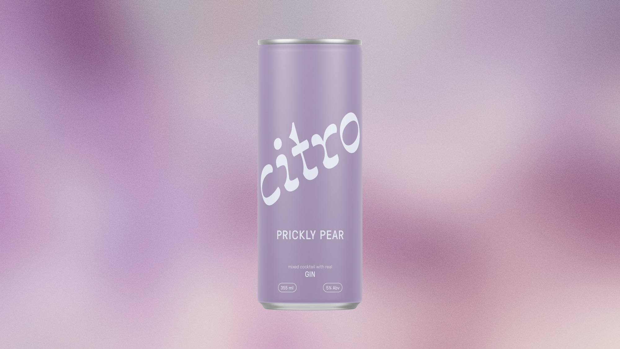 A single can of pear-flavored Citra brand seltzer beverage on a blurred background of soft purple tones in a studio setting.