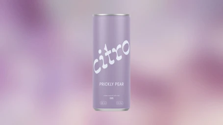 A cylindrical lavender beverage can featuring the brand name Citro and prickly pear flavor text against a soft gradient background.